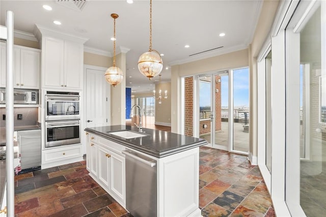 625 St Charles Ave Phd, Phd, New Orleans, LA 70130 - kitchen featuring stainless steel appliances, dark countertops, crown molding, recessed lighting, and stone tile flooring