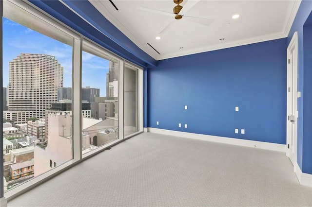 625 St Charles Ave Phd, Phd, New Orleans, LA 70130 - spare room featuring crown molding, carpet, a ceiling fan, a city view, and recessed lighting