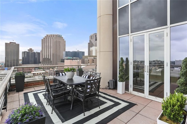 625 St Charles Ave Phd, Phd, New Orleans, LA 70130 - balcony featuring a view of skyline and outdoor dining area