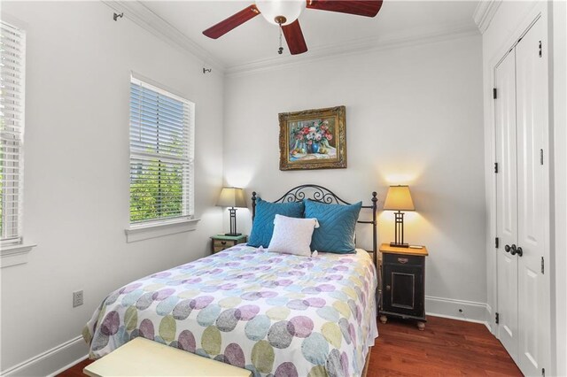 1210 Lyons St Unit 1210, New Orleans, LA 70115 - bedroom featuring wood finished floors, a closet, ornamental molding, and ceiling fan