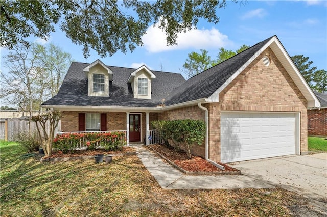 19199 Hector St, Mandeville, LA 70471 - view of front of property featuring brick siding, covered porch, an attached garage, concrete driveway, and a shingled roof