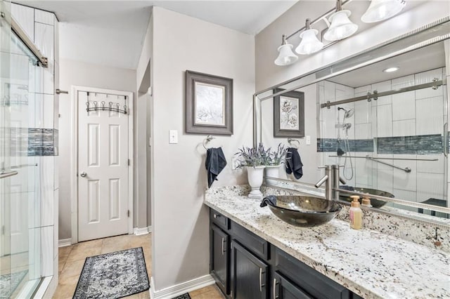 19199 Hector St, Mandeville, LA 70471 - bathroom featuring a stall shower, vanity, and tile patterned flooring