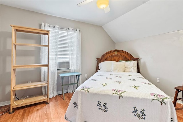 19199 Hector St, Mandeville, LA 70471 - bedroom with lofted ceiling, wood finished floors, a ceiling fan, and cooling unit