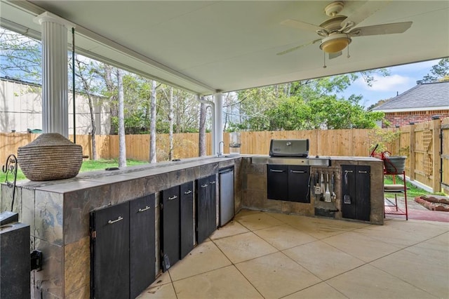 19199 Hector St, Mandeville, LA 70471 - fenced backyard featuring an outdoor kitchen, ceiling fan, and a patio area