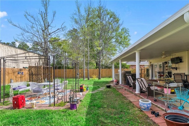 19199 Hector St, Mandeville, LA 70471 - fenced backyard with a patio and a ceiling fan