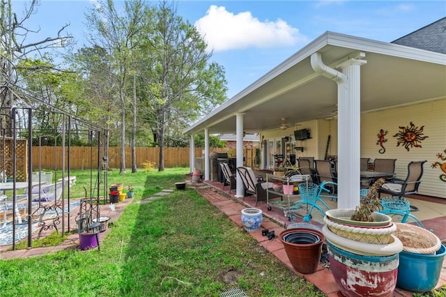 19199 Hector St, Mandeville, LA 70471 - fenced backyard with a patio and a ceiling fan