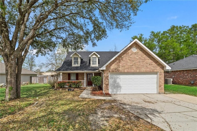 19199 Hector St, Mandeville, LA 70471 - view of front of property with brick siding, a garage, driveway, and a porch