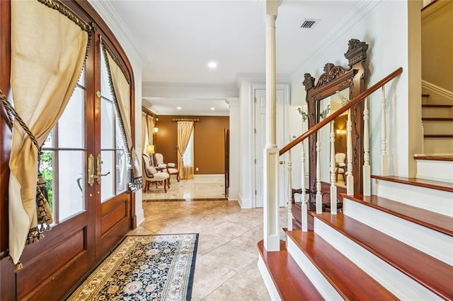 4917 Lake Vista Dr, Metairie, LA 70006 - tiled entrance foyer featuring decorative columns, stairs, ornamental molding, french doors, and recessed lighting
