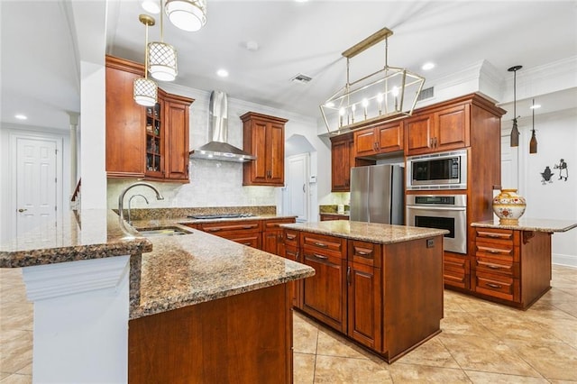 4917 Lake Vista Dr, Metairie, LA 70006 - kitchen with wall chimney exhaust hood, appliances with stainless steel finishes, a peninsula, recessed lighting, and stone counters