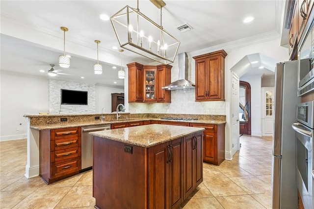 4917 Lake Vista Dr, Metairie, LA 70006 - kitchen featuring wall chimney range hood, stainless steel appliances, a ceiling fan, tasteful backsplash, and light tile patterned floors