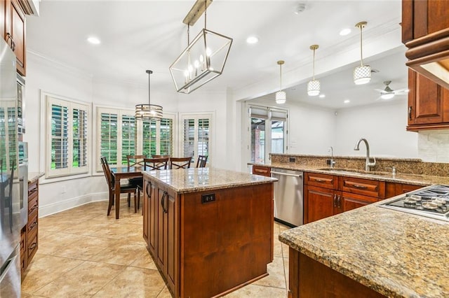 4917 Lake Vista Dr, Metairie, LA 70006 - kitchen with appliances with stainless steel finishes, ornamental molding, light tile patterned floors, a ceiling fan, and a peninsula