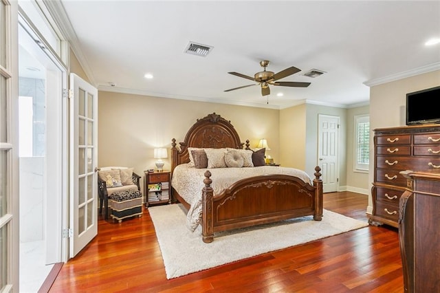 4917 Lake Vista Dr, Metairie, LA 70006 - bedroom featuring dark wood finished floors, ornamental molding, recessed lighting, a ceiling fan, and french doors
