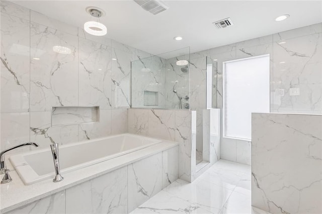 4917 Lake Vista Dr, Metairie, LA 70006 - full bathroom with a garden tub, a marble finish shower, recessed lighting, and marble tiled floors
