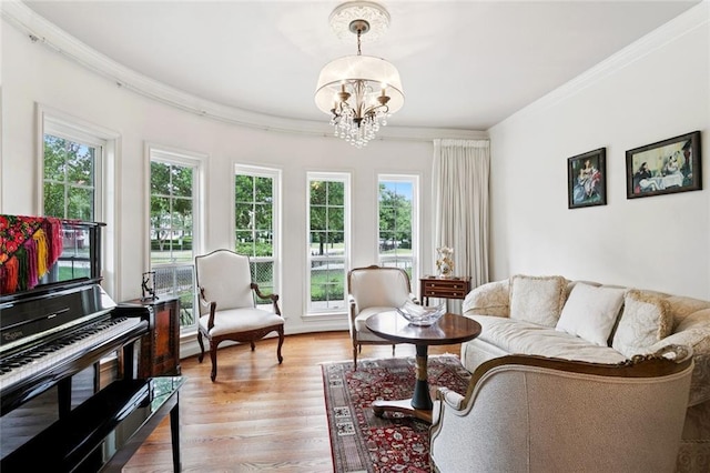 5018 St Charles Ave, New Orleans, LA 70115 - living area featuring a chandelier, ornamental molding, and light wood-style floors