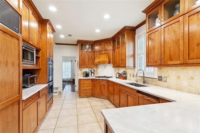 5018 St Charles Ave, New Orleans, LA 70115 - kitchen with built in appliances, premium range hood, decorative backsplash, recessed lighting, and light tile patterned floors