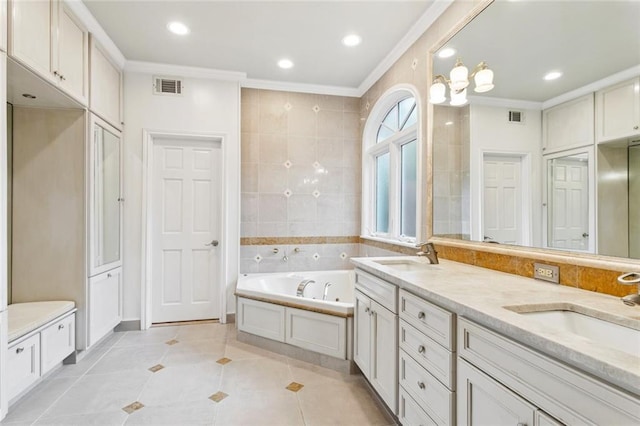 5018 St Charles Ave, New Orleans, LA 70115 - bathroom with ornamental molding, a jetted tub, double vanity, tile patterned flooring, and recessed lighting