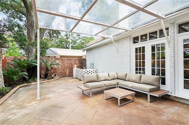 5018 St Charles Ave, New Orleans, LA 70115 - view of patio featuring an outdoor living space and french doors