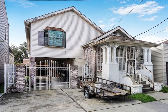 4124 Eve St, New Orleans, LA 70125 - view of front facade featuring a gate and driveway