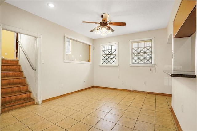 4124 Eve St, New Orleans, LA 70125 - empty room with a ceiling fan, stairs, recessed lighting, and light tile patterned floors