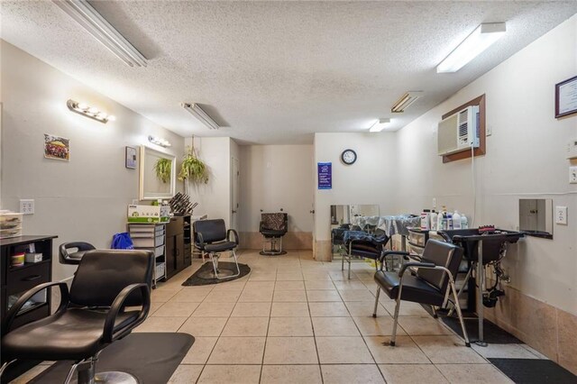 4124 Eve St, New Orleans, LA 70125 - interior space featuring a textured ceiling, light tile patterned floors, and an AC wall unit