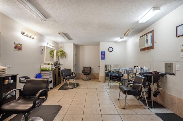 4124 Eve St, New Orleans, LA 70125 - interior space featuring a textured ceiling, light tile patterned floors, and an AC wall unit