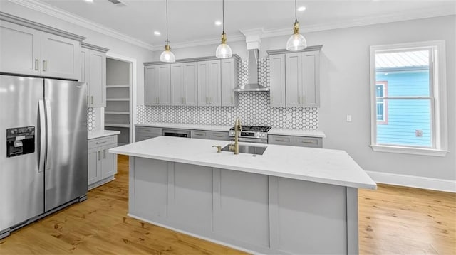 1908 Benjamin St, Arabi, LA 70032 - kitchen with stainless steel appliances, gray cabinets, wall chimney exhaust hood, decorative backsplash, and recessed lighting