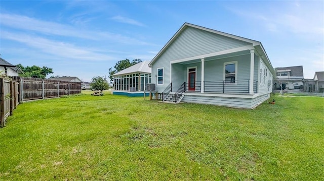 1908 Benjamin St, Arabi, LA 70032 - back of property featuring a sunroom and covered porch