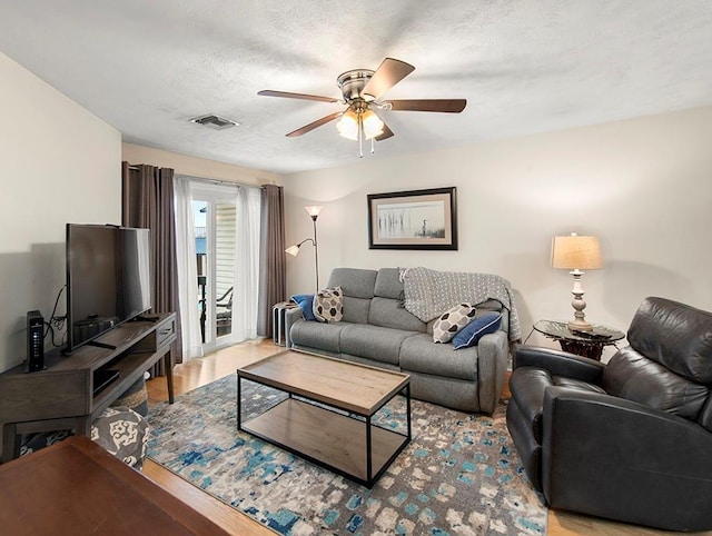 420 Metairie Hammond Hwy Unit 225, Metairie, LA 70005 - living room featuring ceiling fan, wood finished floors, and a textured ceiling