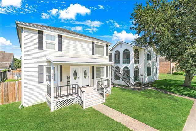 694244 Canal Blvd, New Orleans, LA 70115 - traditional-style home with covered porch and stairs