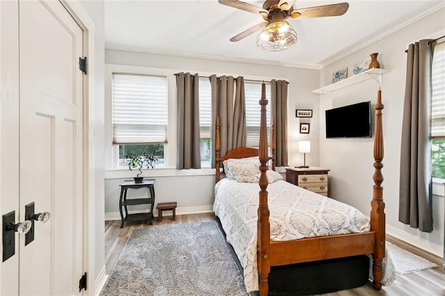 106 Rowley Blvd, La Place, LA 70068 - bedroom with wood finished floors, crown molding, and ceiling fan