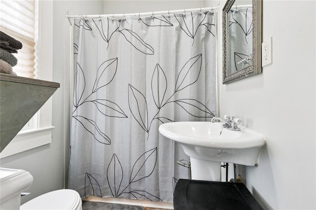 106 Rowley Blvd, La Place, LA 70068 - bathroom featuring toilet and wood finished floors