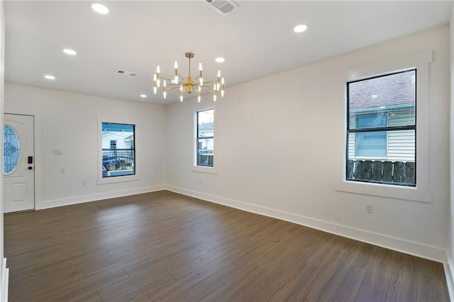 1721 Eagle St, New Orleans, LA 70118 - empty room with a chandelier, dark wood-style floors, and recessed lighting