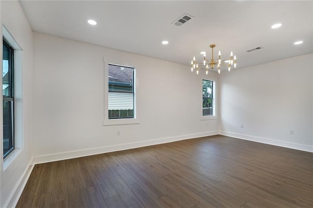 1721 Eagle St, New Orleans, LA 70118 - spare room with a chandelier, dark wood-style flooring, and recessed lighting