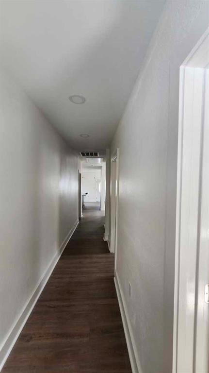 1721 Eagle St, New Orleans, LA 70118 - hallway featuring baseboards and dark wood-style flooring