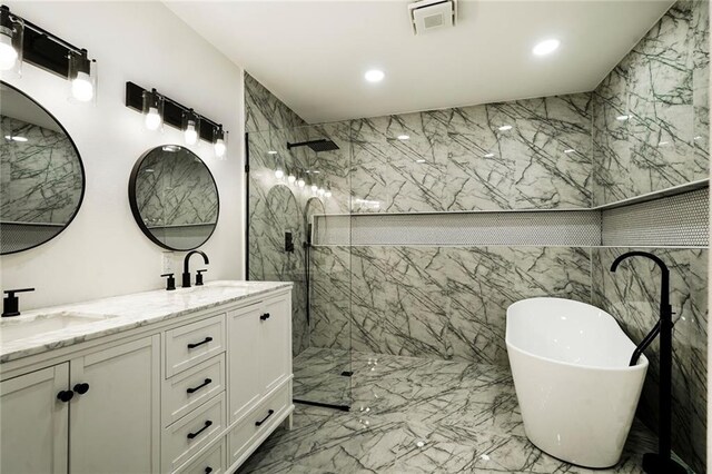 1721 Eagle St, New Orleans, LA 70118 - bathroom with a marble finish shower, a soaking tub, double vanity, marble tiled flooring, and recessed lighting