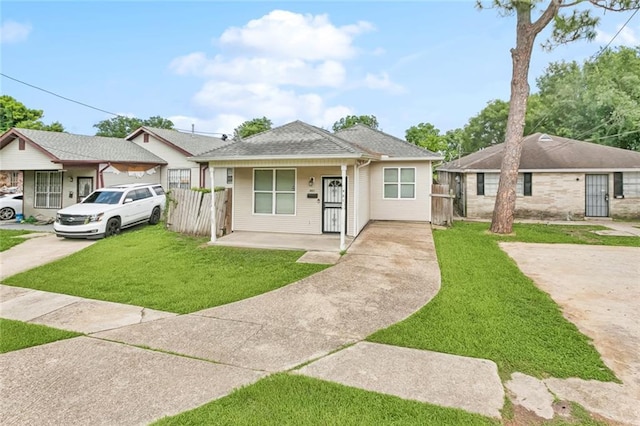 921 Jourdan Ave, New Orleans, LA 70117 - bungalow-style home with driveway, a porch, and roof with shingles