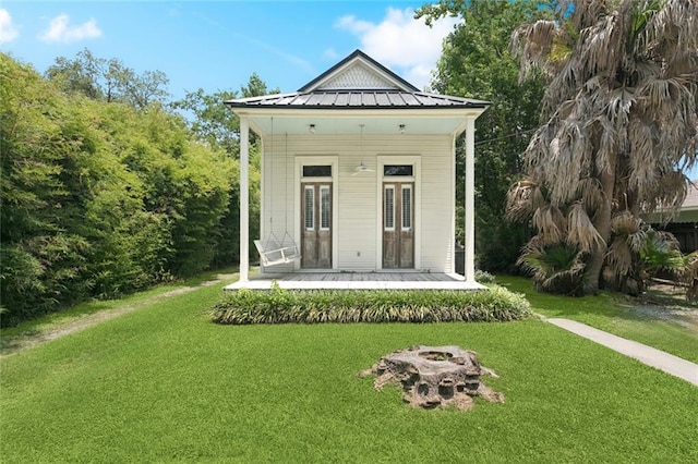 2027 Monroe St, Mandeville, LA 70448 - view of outdoor structure featuring covered porch