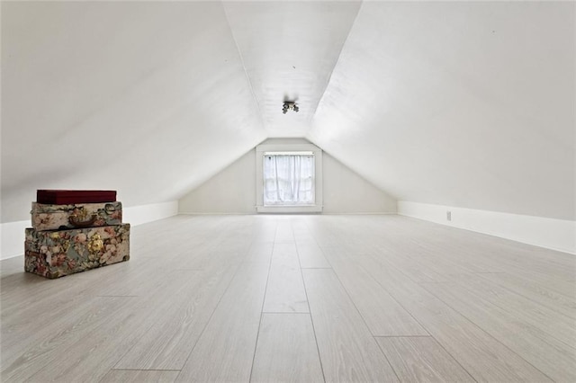 2027 Monroe St, Mandeville, LA 70448 - additional living space with lofted ceiling and wood finished floors