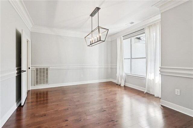 35 Elmwood Loop, Madisonville, LA 70447 - unfurnished dining area featuring a chandelier, ornamental molding, and dark wood finished floors