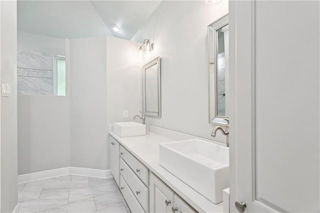 35 Elmwood Loop, Madisonville, LA 70447 - bathroom with marble look tile flooring and double vanity
