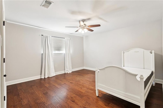 35 Elmwood Loop, Madisonville, LA 70447 - unfurnished bedroom featuring wood finished floors and ceiling fan