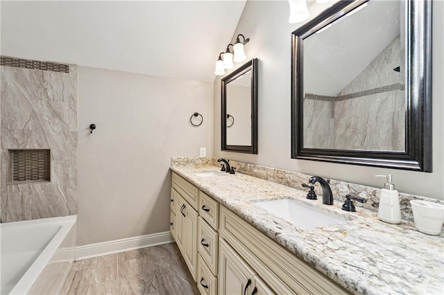 35 Elmwood Loop, Madisonville, LA 70447 - bathroom with marble look tile flooring and double vanity