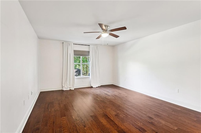 35 Elmwood Loop, Madisonville, LA 70447 - spare room with a ceiling fan and dark wood-style flooring