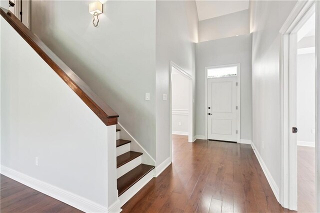 35 Elmwood Loop, Madisonville, LA 70447 - foyer entrance featuring wood-type flooring, stairway, and a high ceiling