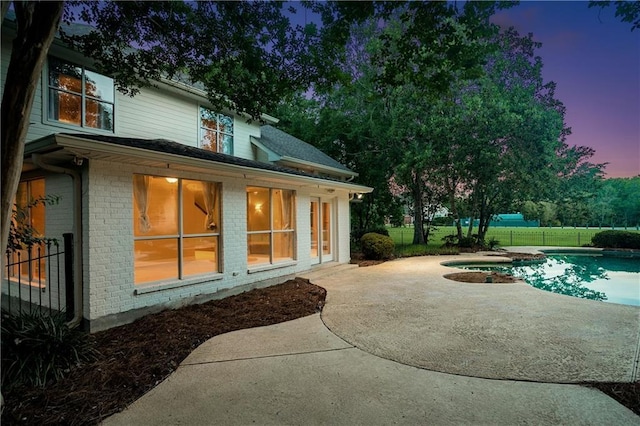 35 Elmwood Loop, Madisonville, LA 70447 - rear view of property with a patio area and brick siding