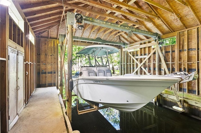 35 Elmwood Loop, Madisonville, LA 70447 - view of car parking featuring boat lift and a dock