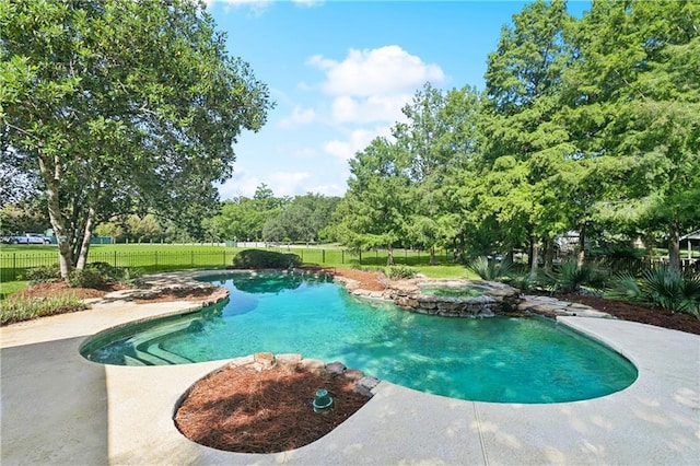 35 Elmwood Loop, Madisonville, LA 70447 - view of pool featuring a pool with connected hot tub and a patio area