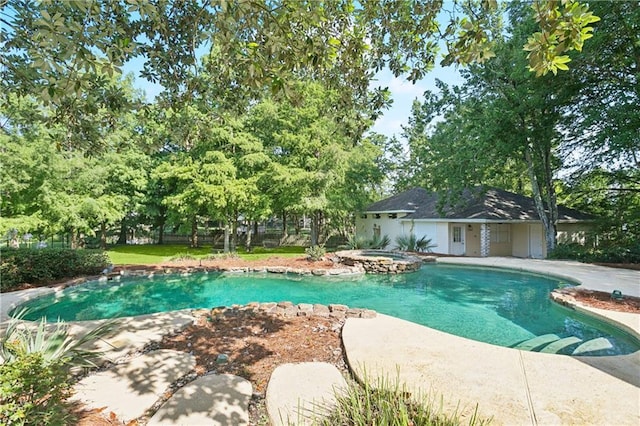 35 Elmwood Loop, Madisonville, LA 70447 - view of pool with a patio, a pool with connected hot tub, and an outbuilding
