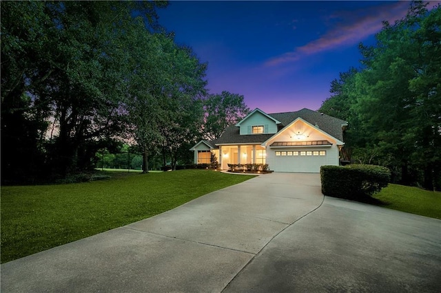 35 Elmwood Loop, Madisonville, LA 70447 - traditional-style home with concrete driveway, an attached garage, and a yard