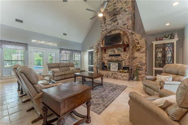 31 Allen Hill Rd, Tylertown, MS 39667 - living room featuring a ceiling fan, high vaulted ceiling, light tile patterned floors, a fireplace, and french doors